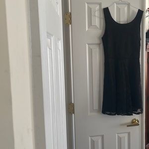 Wet Seal, size M, my daughter size 6 fit beautifully. Black with lace overlay.